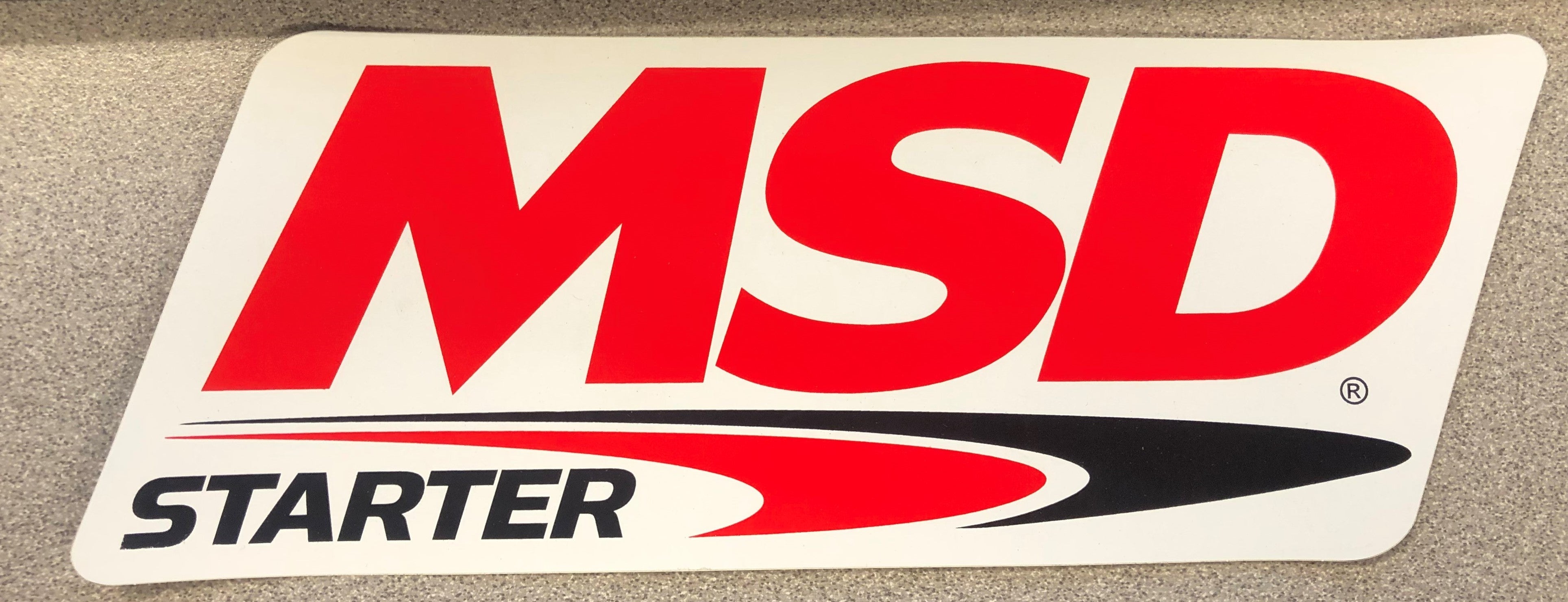 The MSD STARTER Logo Decal; Red, Black & White. 9.25" wide x 3.375" high.