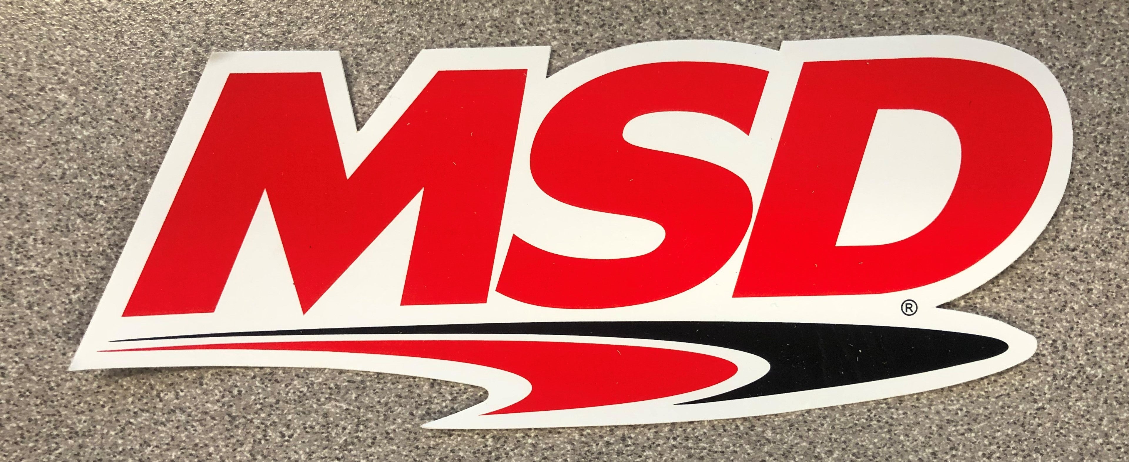 The MSD Logo Decal, Red, Black & White. 5.5" wide x 2" high.