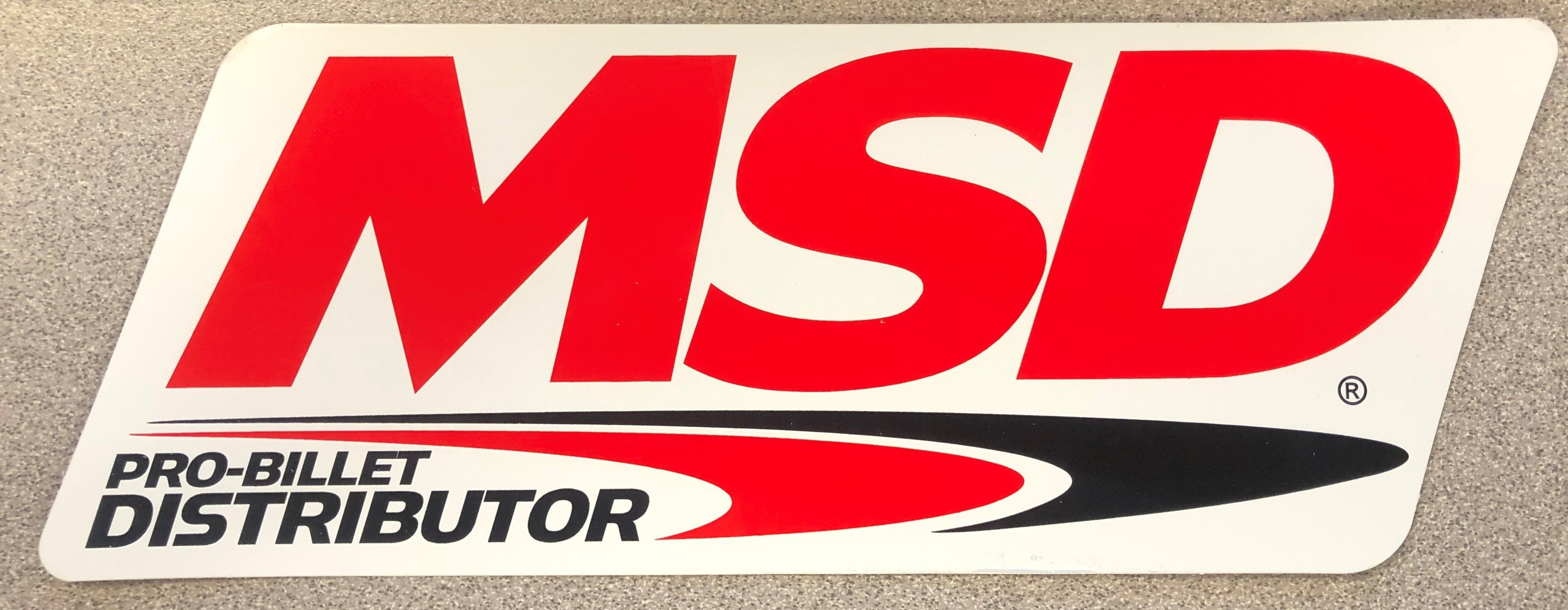 The MSD Logo Decal, Red, Black & White. 9.25" wide x 3.375" high.