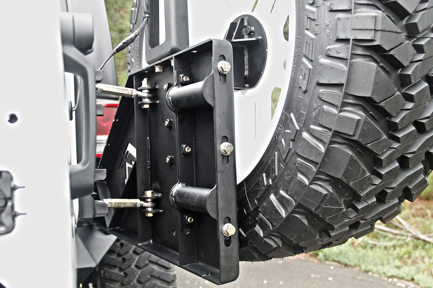Fab Fours JP-Y1261T-1 Off The Door Tire Carrier; 2 Stage Black Powder Coated; Needs Base Bumper; Fab Fours JP-Y1261T-1